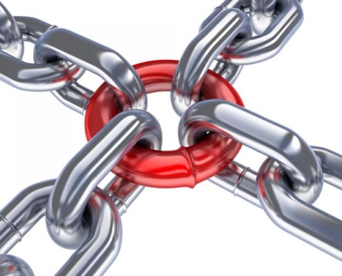 Cadenas unidas a un eslabón rojo